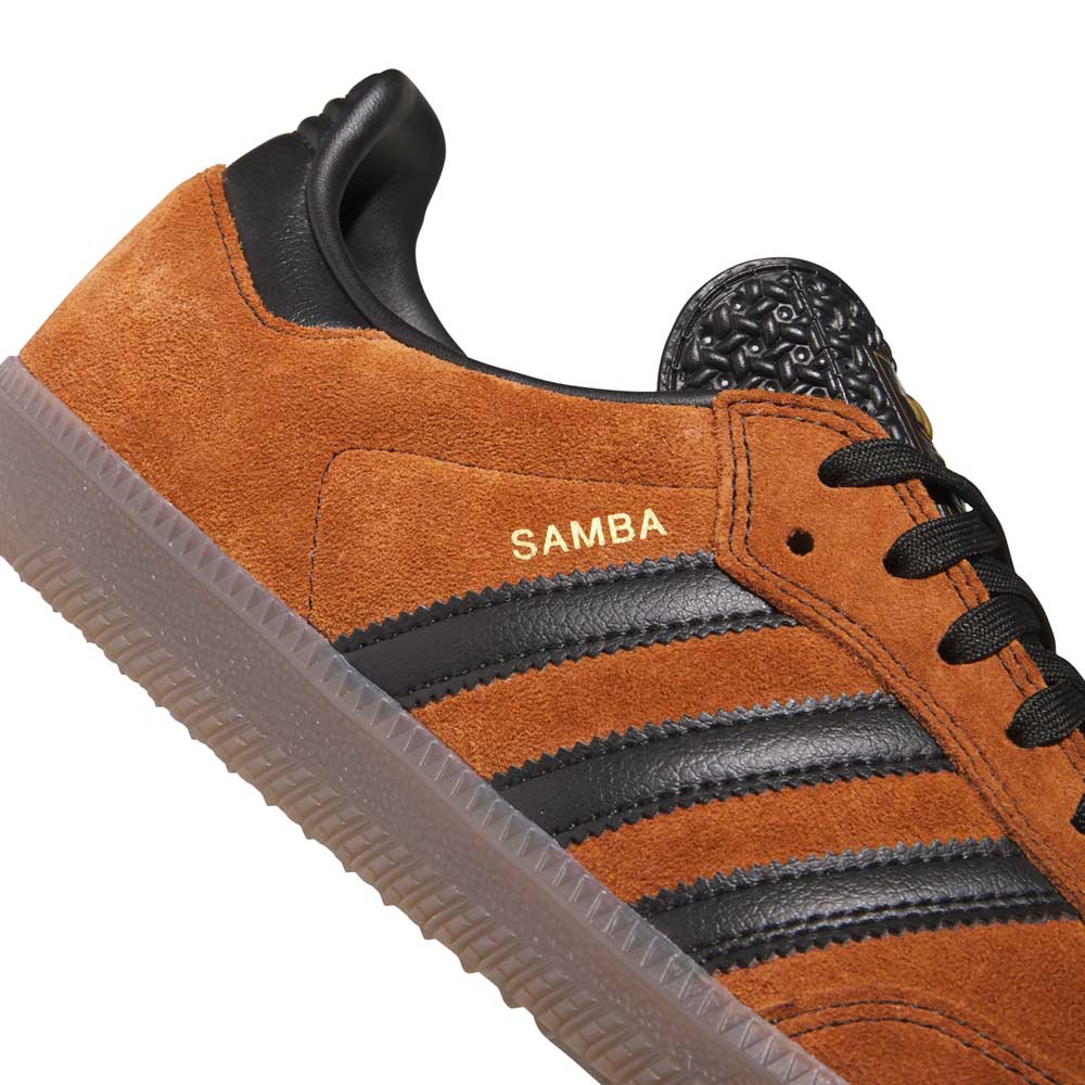 Close-up of the Samba ADV Brown Black HQ9286 Adidas Skateboarding shoe in brown suede with black leather stripes, black laces, gold "SAMBA" on the side, and a translucent textured sole for a modern update to classic style.