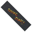 The Shake Junt Tanner Burzinski Signature Grip Tape 9in x 33in Sheet by Graphic Mob is black, bubble-free, and features bold yellow and red flame-style "Shake Junt" lettering across the center.