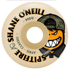 The Shane Oneill April 54mm 99A Spitfire Wheels Skateboard features a beige wheel design with "SHANE ONEILL SPITFIRE CLASSIC" text and a playful cartoon orange face sporting a cap, wide grin, and sharp teeth. Camouflage details and graphic accents highlight the iconic Spitfire Wheels craftsmanship. Engineered for top performance, these 54mm 99A wheels deliver the durability and grip essential for every skate session.