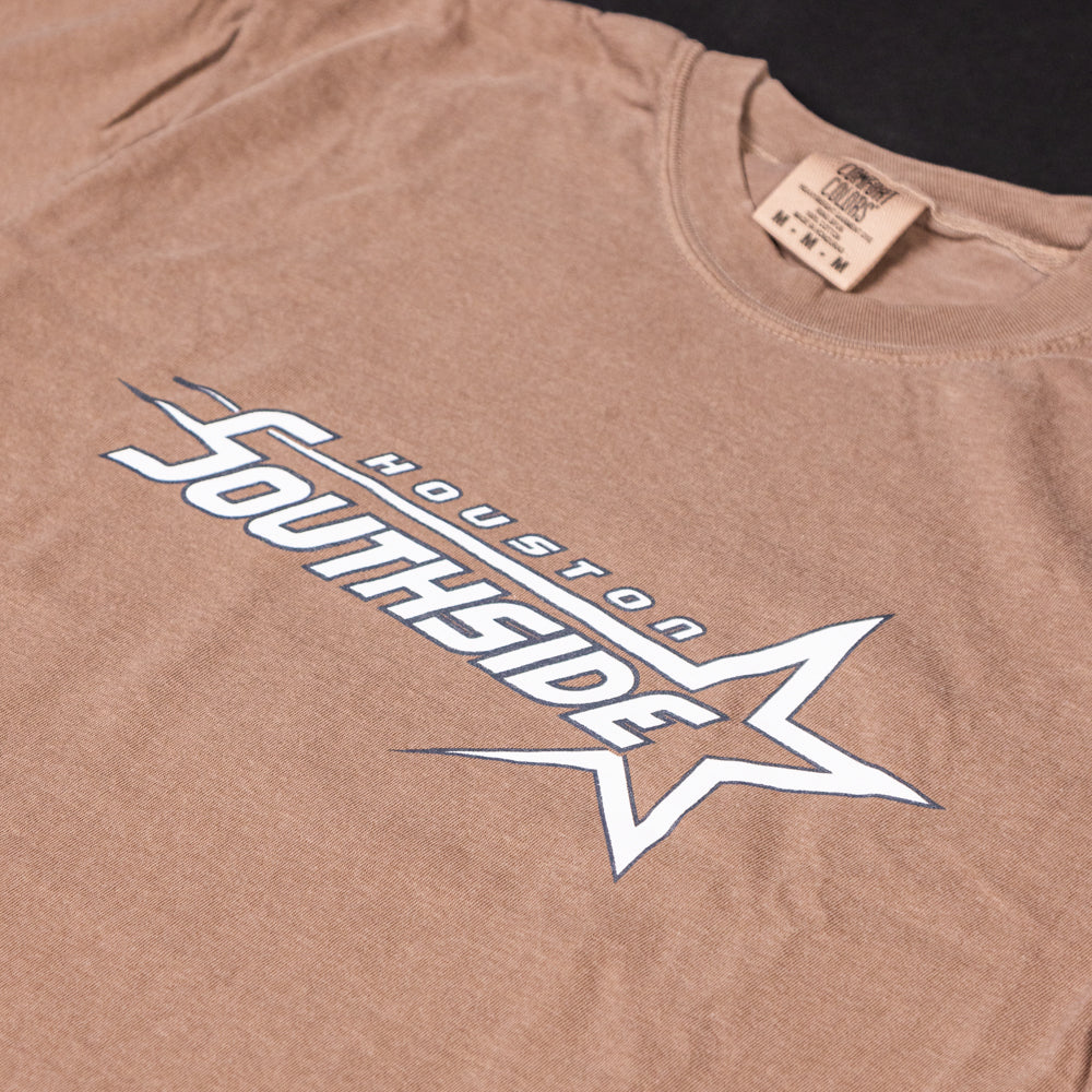 The Southside Sharp Star T-Shirt in Coffee Gray Sky features "Houston Southside" in white with a black outline and a stylized star graphic on the front—finished with a visible shirt tag for classic skate style.