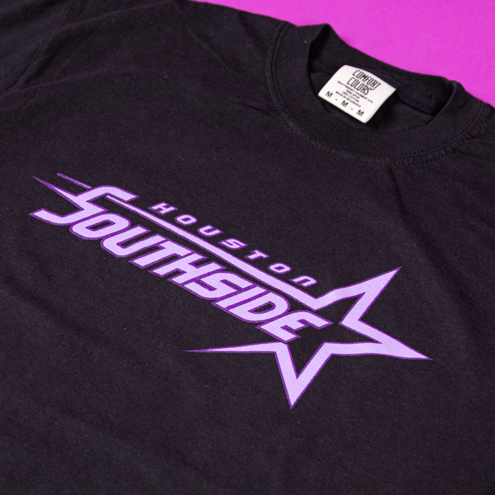 The Southside Sharp Star T-Shirt is a black tee featuring a large purple star and bold “Houston Southside” lettering in purple and lavender—screenprinted, perfect for fans of Southside Skatepark.
