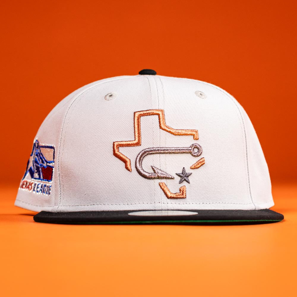 The Backlash Corpus Christi Hooks New Era 5950 Fitted Hat features a silver and black design, white crown, black brim, front Texas outline with fish hook and star embroidery, plus a colorful side patch on bold orange.