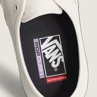 Close-up of the Skate Authentic White Gunmetal Vans VNOA5FC8XQL Suede White Skateboarding Shoe’s interior, featuring a durable Pop Cush insole with Vans, Skateboarding, and Pop Cush logos for enhanced comfort and grip traction.