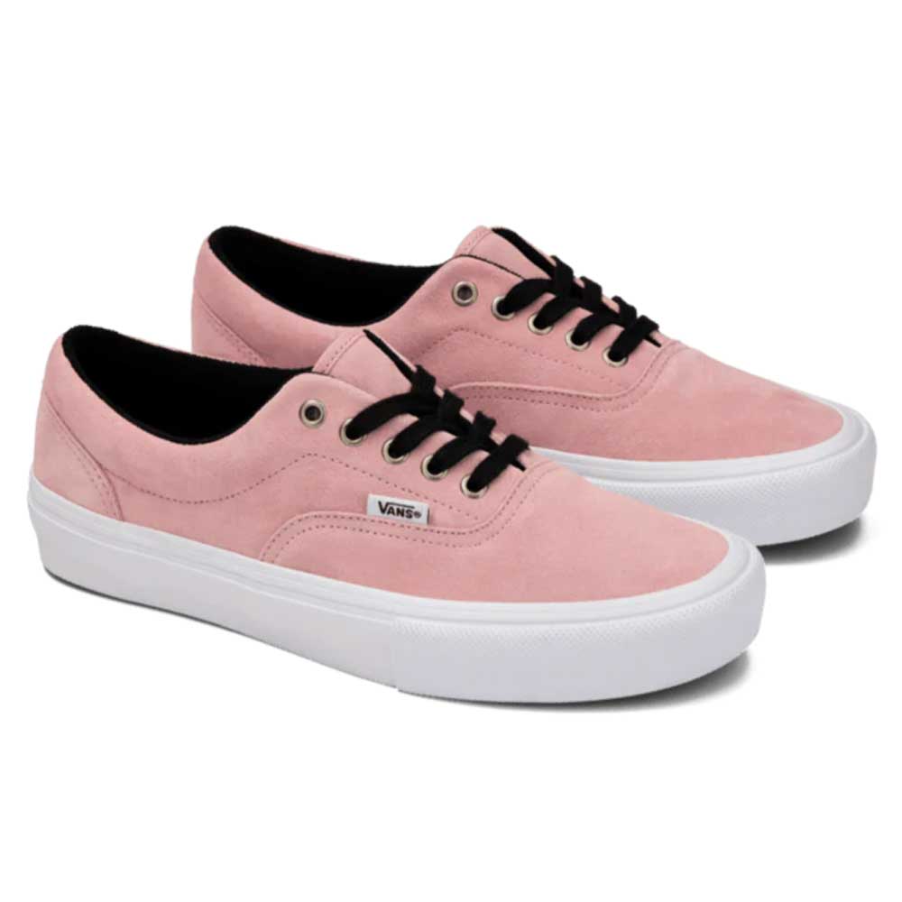 The Skate Era Mauve Mist VN000ECRZSB Vans shoes feature pink suede, white rubber soles, black laces, metal eyelets, a low-top design with modern skate tech for impact protection, and a small Vans logo tag on the side.