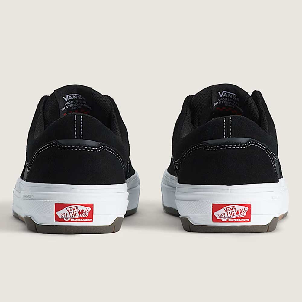 A pair of Vans Skate Era Wafflecup Black White VN000EF0BA21 suede skate shoes shown from the back, featuring white midsoles, red Off The Wall heel tabs, and signature WaffleCup outsoles for enhanced boardfeel.