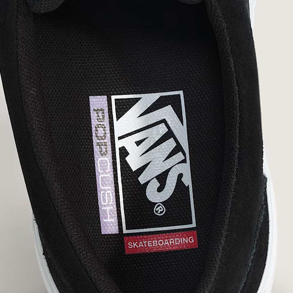 Close-up of the insole of the Vans Skate Era Wafflecup Black White VN000EF0BA21 suede rubber shoe, featuring the Vans logo, purple PopCush footbeds, and red "Skateboarding" text on a black background for comfort and support.