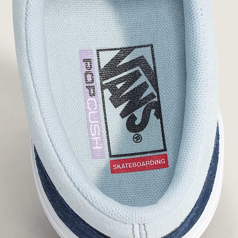 Close-up of the inner heel of the Skate Era Wafflecup Navy Blue Bell VN000EF0J4I1 Vans Suede Rubber Shoes, highlighting the black Vans logo, “POP CUSH” on PopCush footbeds, and a red “SKATEBOARDING” label on the insole.