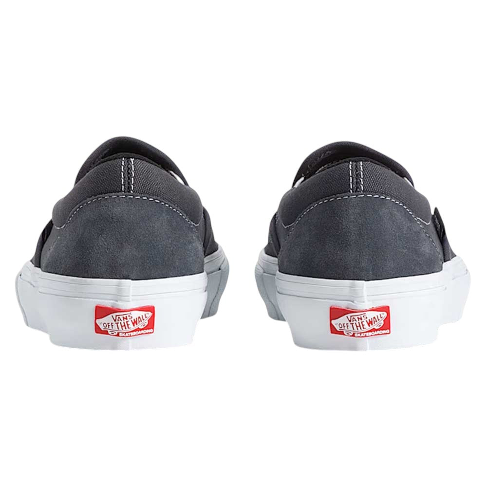 Two Vans Skate Slip On Pewter True White VN0A5FCA1N6 suede shoes are shown from the back, featuring white soles and red Vans Off the Wall logos on the heels for enhanced durability and impact protection.