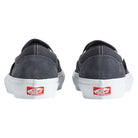 Two Vans Skate Slip On Pewter True White VN0A5FCA1N6 suede shoes are shown from the back, featuring white soles and red Vans Off the Wall logos on the heels for enhanced durability and impact protection.