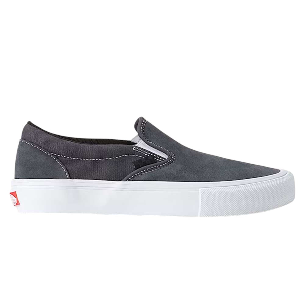 The Skate Slip On Pewter True White VN0A5FCA1N6 Vans Suede Shoe features a gray suede upper with white stitching, a white rubber sole, and a red Vans logo tag on the heel. Shown in side profile against a white background, this slip-on sneaker is designed for enhanced durability and impact protection, seamlessly blending style and performance.