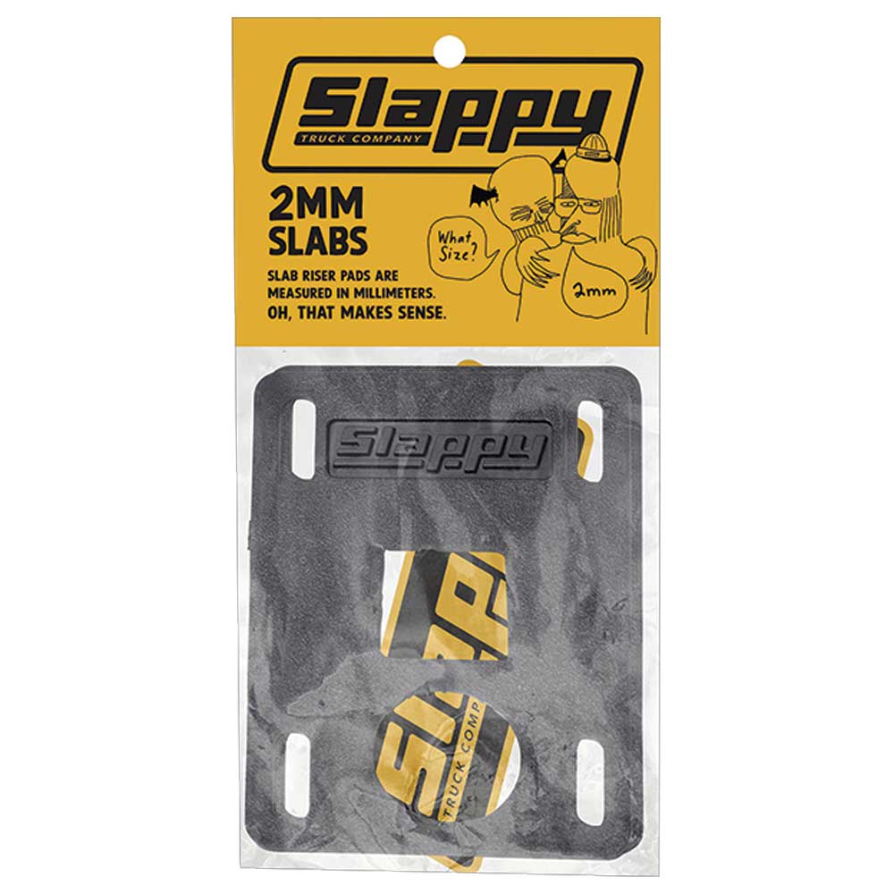 A pair of Slappy Slabs 2mm Black Low Risers for skateboards, packaged in a clear front bag with yellow branding and a graphic on top, designed to help prevent wheel bite.