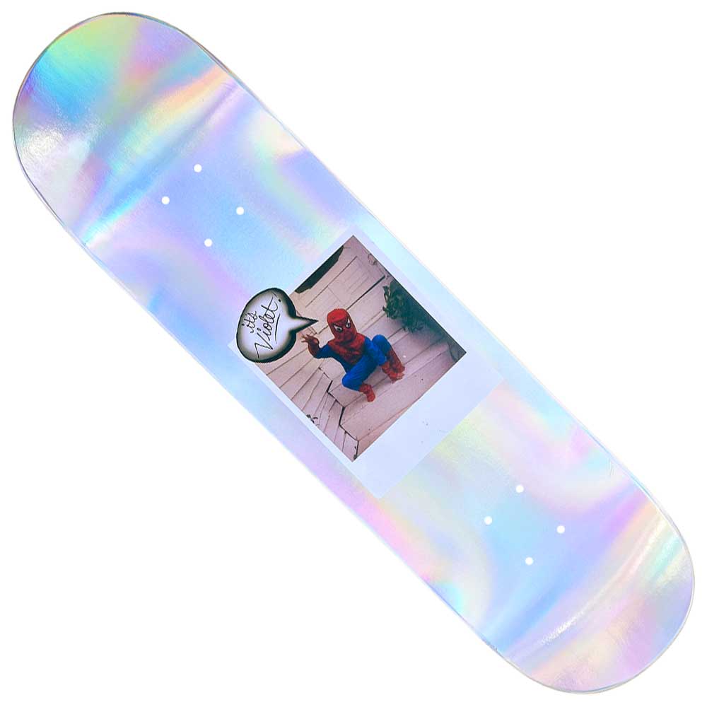 The Spiderman Polaroid 8.5 Violet Skateboards Deck displays an iridescent photo of someone in a Spider-Man costume on white stairs, with a circular logo in the photo’s top left corner.