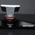 Close-up of Stage 4 Eric Dressen Pro 166 Black Silver Standard INDY Trucks (set of two) with a red INDEPENDENT bushing and DRESSEN text, set against a dark background.