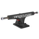 A set of two “151 Stage 4 Hollow Full Bar Black Standard Trucks” from Independent, featuring a black finish with INDEPENDENT printed upside down in white on the hanger, a red bushing, and mounting holes on the baseplate—ideal for anyone seeking quality Stage 4 trucks.