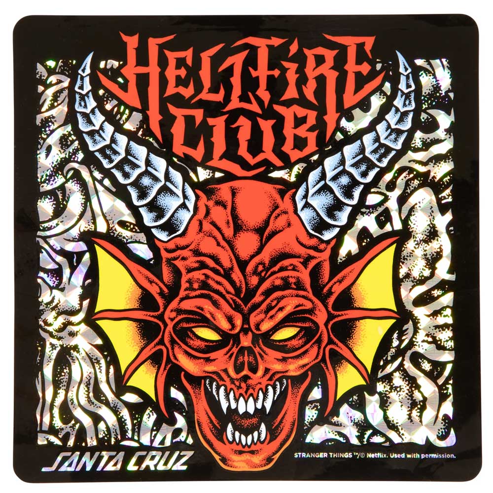 The Stranger Things Hellfire Club 8.25in x 31.8in Santa Cruz Skateboard Deck features a red demon face with yellow eyes, fangs, white horns, "Hellfire Club" in fiery letters above, and a psychedelic black and silver swirl background.