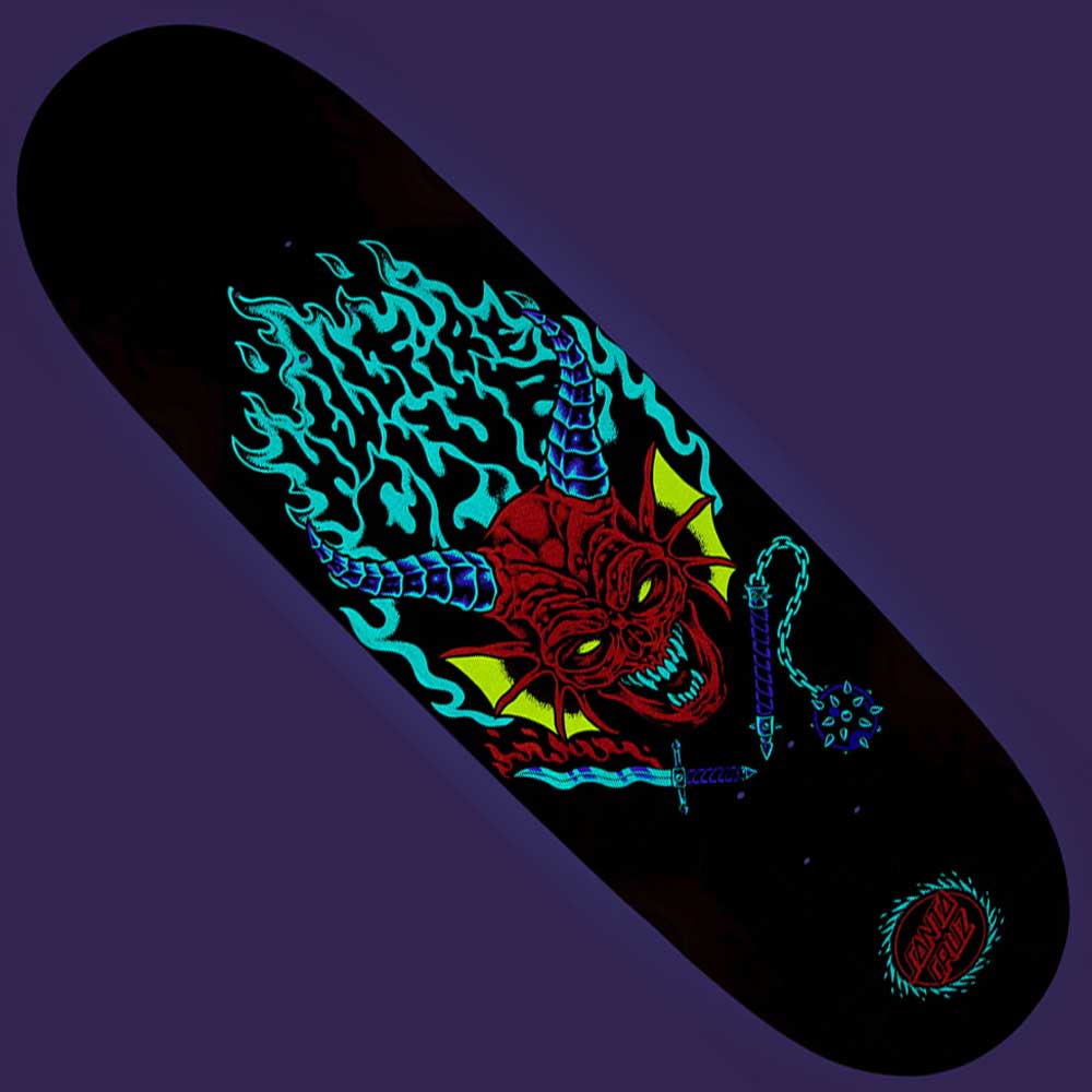 The Stranger Things Hellfire Club Flames 9.00in x 32.00in Santa Cruz Skateboard Deck features neon art of a red demon head with horns, sharp teeth, yellow eyes, flames, and a spiked mace, plus the Santa Cruz logo on a dark background.