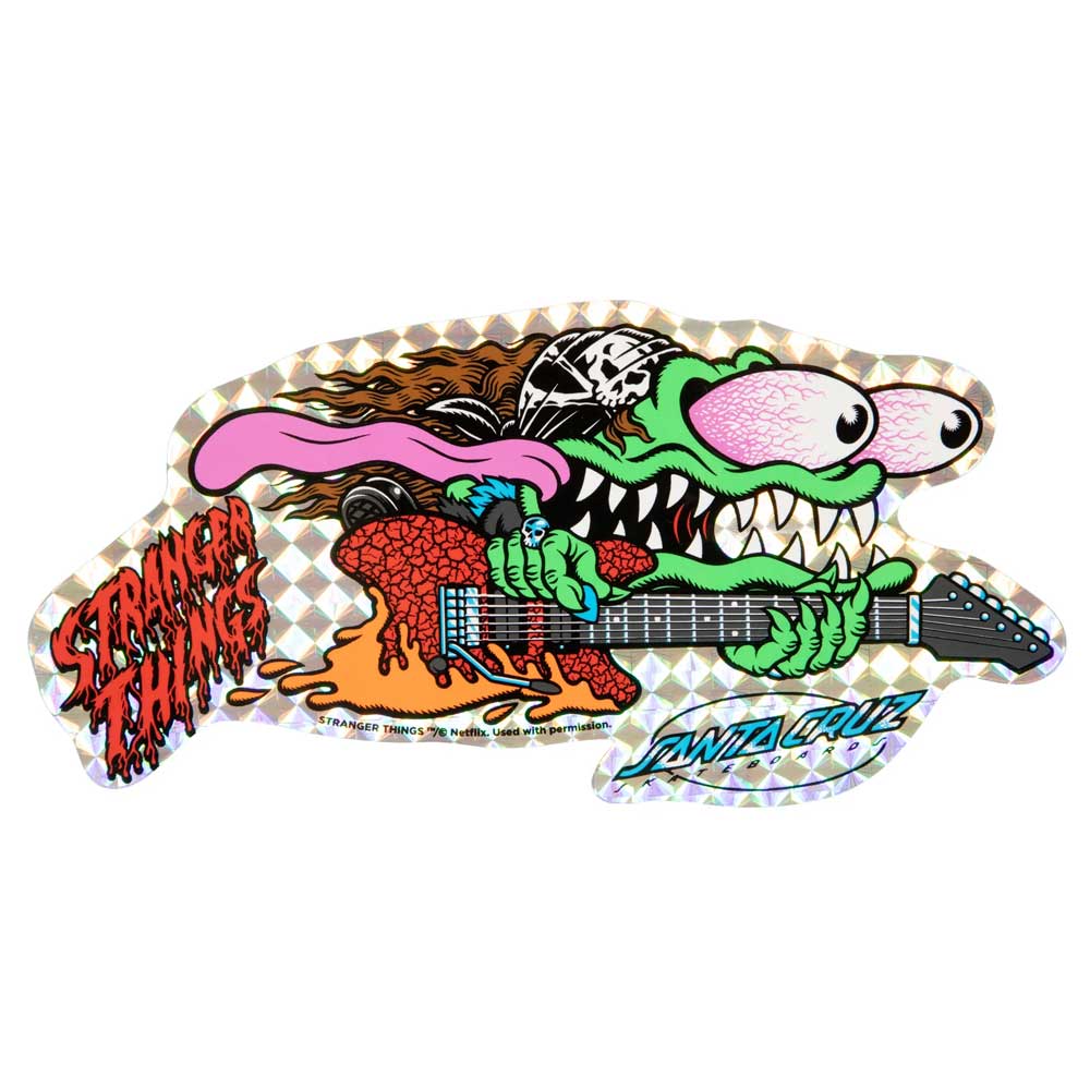 A vibrant monster with sharp teeth shreds an electric guitar atop the Stranger Things Meek Slasher Eddie Reveal 10.1in x 31.13in Santa Cruz Skateboard Deck, set against a holographic background with Stranger Things and Santa Cruz logos.