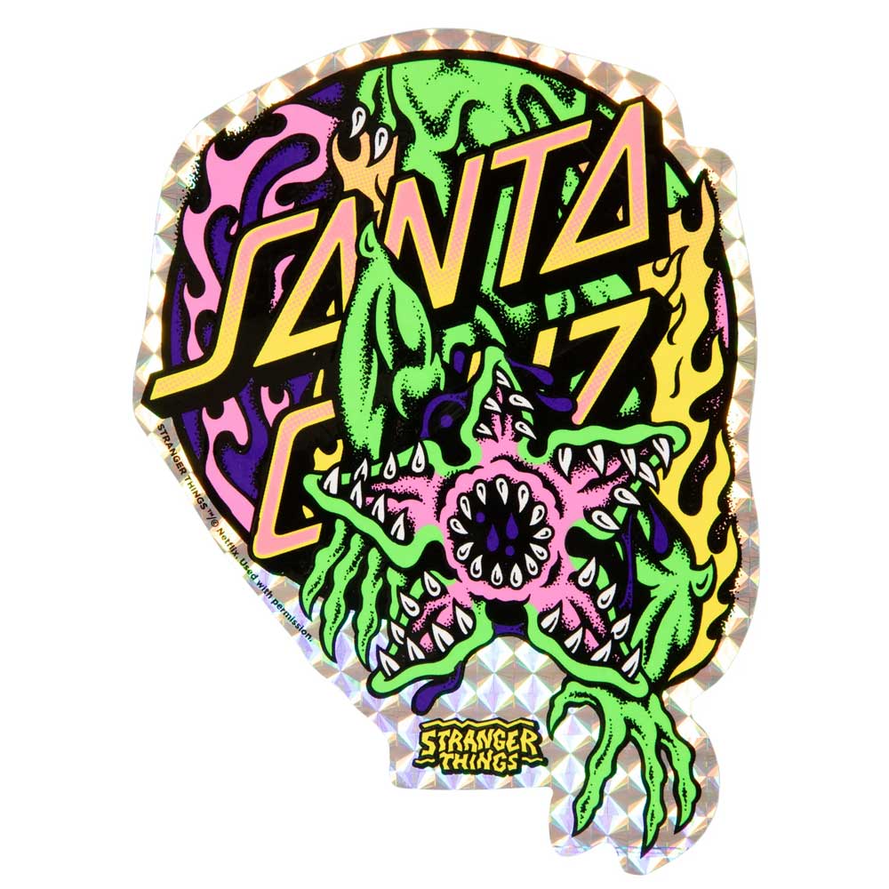 The Stranger Things Salba Demogorgon 10.3in x 31.1in Santa Cruz Skateboard Deck features bold Santa Cruz lettering over a monstrous creature with sharp teeth and green limbs, plus the Stranger Things logo on vibrant, swirling colors.