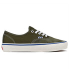 A side view of the Suede Canvas Mossy Olive Authentic VN0A5FC8FR11 Vans Skate Skateboarding Shoe features olive green suede and canvas, white stitching and laces, a white rubber sole, PopCush footbeds, and a blue-and-white checkerboard tag near the laces.
