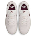 Summit White Mystic Dates Code 58 IB0108102 Nike SB Skateboarding Suede Shoes in white with a maroon swoosh and branding on the tongue and insole.