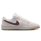 Summit White Mystic Dates Code 58 IB0108102 Nike SB Skateboarding Suede Shoes featuring an off-white low-top design with a dark red swoosh and a gum rubber sole.