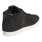 The adidas Superskate x Kader Shoes (JQ4413) feature a black suede and leather upper, textured details, signature Superskate stripes, “KADER” in gold, a white sole, and a snakeskin-style heel. Perfect for skateboarding in style.