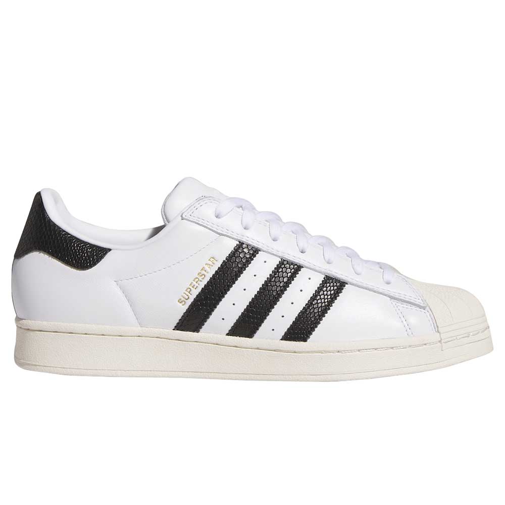 The adidas Superstar ADV White Black KI5727 Skateboarding Shoe features black stripes, a textured black heel, gold SUPERSTAR text, and a white rubber shell toe—an iconic suede and leather option from adidas Originals.