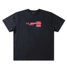 Tape Crux Former Tee Black: A black 200GSM cotton T-shirt featuring a pink screen print graphic with the word “FORMER” across the chest.