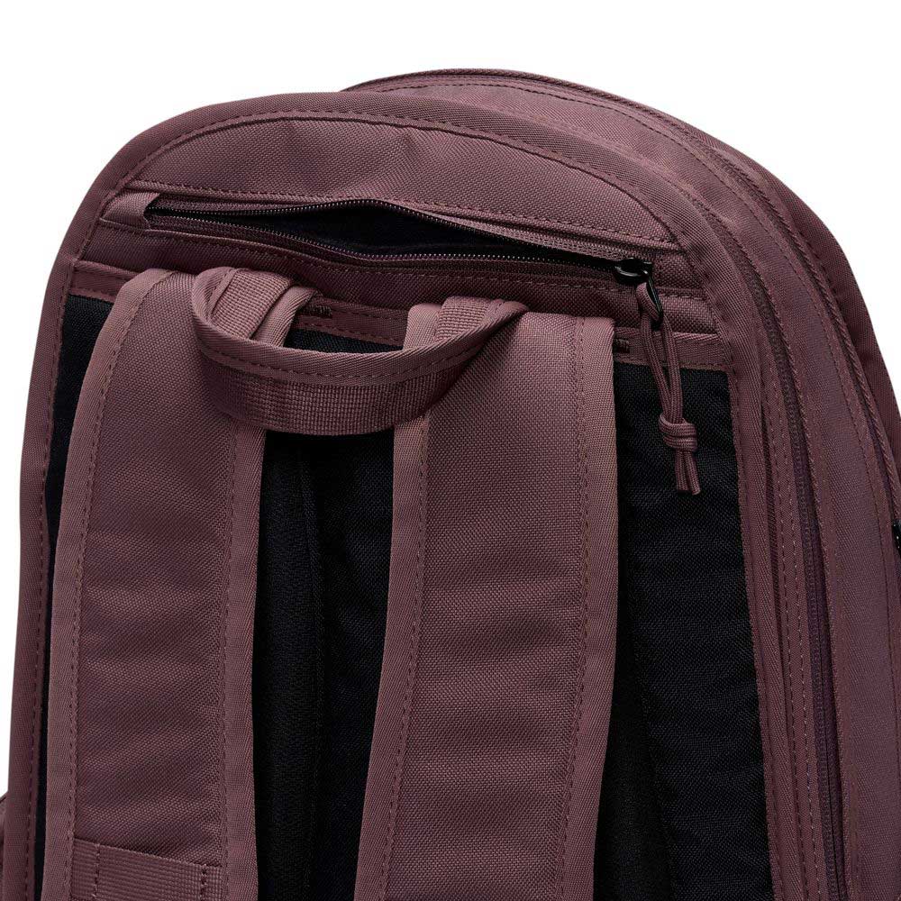 Close-up of the back of the Tattoo Black Light Violet FD7544502 Nike SB RPM Skate Backpack, featuring padded shoulder straps, a carry handle, and a top zippered compartment—built as a water-resistant skateboarding backpack.