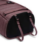 A close-up of the Tattoo Black Light Violet FD7544502 Nike SB RPM Skate Backpack showcases its reinforced black base, adjustable straps, water-resistant fabric, and MOLLE webbing—ideal for skateboarding.