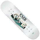 The Team EMB 8.25x31.8 White Real Skateboard Deck features a white brick wall graphic with graffiti-style buildings and "EMB" lettering above, plus scattered small black dots across the design.