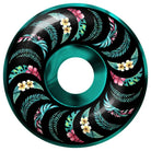 The Team Floral Swirl 53mm 99A Formula Four Spitfire Wheels Classic features a round teal and black design with green leaves and yellow, pink, and white flowers arranged in a swirl pattern.