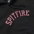 Team Lil Big Head Black Vintage Wash Pullover Hoodie Spitfire Wheels in a vintage wash black color, featuring the word SPITFIRE embroidered in an arched, grey font with a red outline.