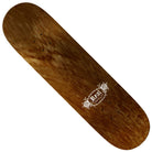 A brown wooden Team Oval by Harry Lintell 8.5x32.18 Real Skateboard Deck, featuring a white floral graphic and “Kali” printed on one end. This deck comes without wheels or trucks attached.