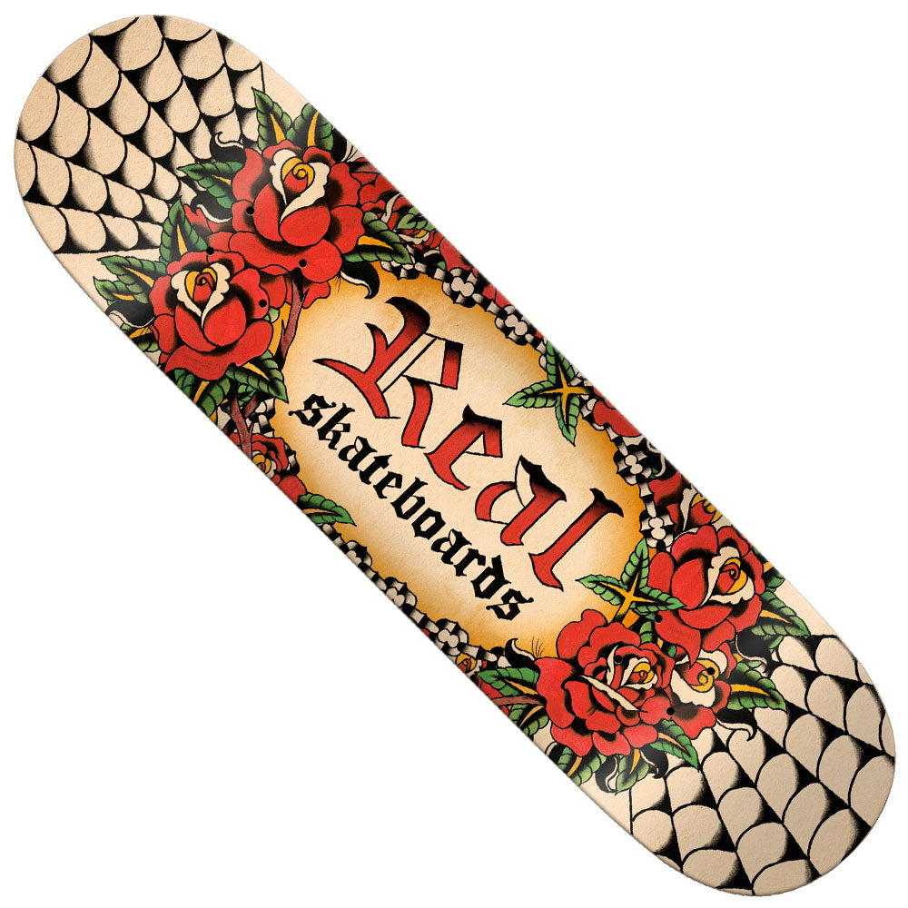 The Team Oval by Harry Lintell 8.5x32.18 Real Skateboard Deck features red roses, green leaves, and “Real skateboards” in Gothic-style lettering atop a beige gradient background with black scale-like patterns at each end.