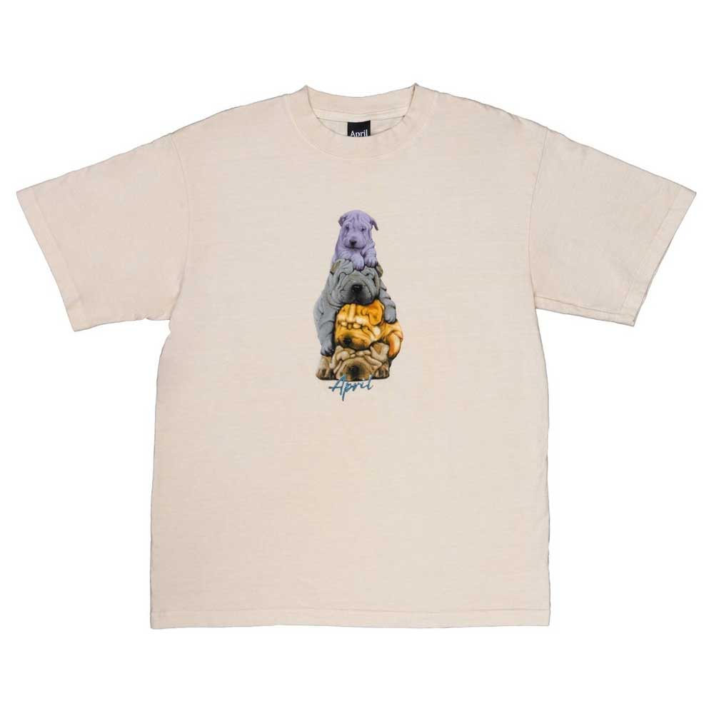 The Dogs Tee Washed Yellow by April Skateboards is a heavyweight beige t-shirt featuring three stacked wrinkly dogs in purple, gray, and yellow, with "Approve" written below the illustration.
