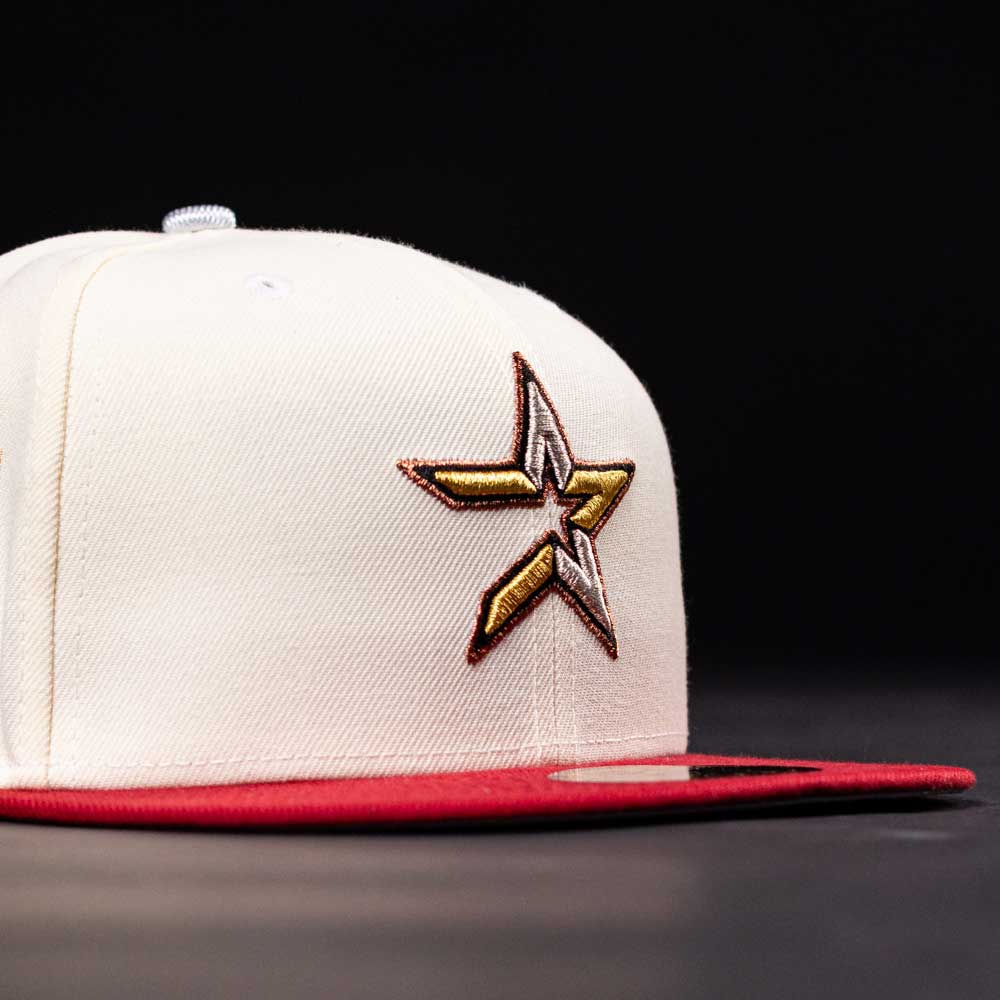 The Final Hour New Era Hat 5950 Fitted NEW YEAR DROP is a white cap with a red brim, featuring a large embroidered star logo in gold, brown, and white on the side. Its black background highlights the vibrant details. Available at Whatafitted.