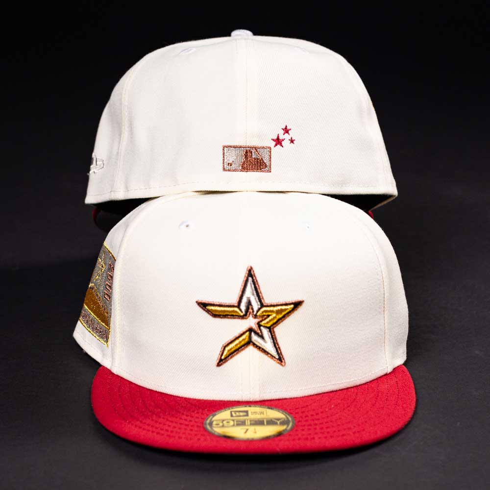 Two white “The Final Hour New Era Hat 5950 Fitted NEW YEAR DROP” baseball caps with red brims. Front displays a gold, white, and brown star with an "A"; back has a small logo and two red stars. Perfect Whatafitted style on black background.