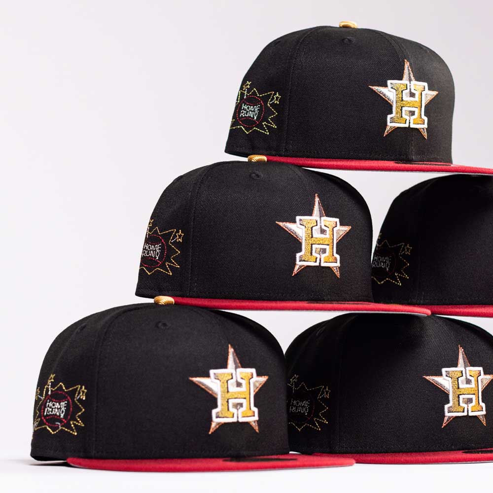 Five The Last Call New Era Hat 5950 Fitted NEW YEAR DROP caps are stacked in a pyramid. Each black cap has a red brim, gold and white H on a star front, with "Home Run" and a star outline embroidered on the side.