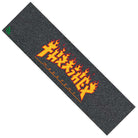 The Thrasher Monster Flame Grip Tape 9in x 33in Sheet Graphic Mob features bold yellow and red flaming Thrasher text at the center with illustrated flames, a small green logo in the corner, and a black rectangular design.