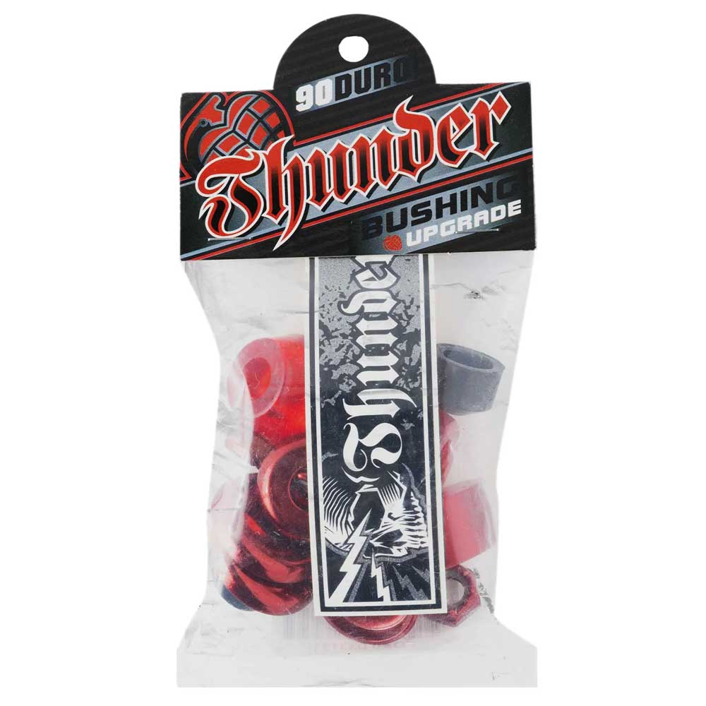 A clear plastic bag holds red Thunder Bushings Rebuild Kit 90A Durometer bushings for skateboard trucks and a black-and-white Thunder sticker; packaging reads Thunder Bushing Upgrade and is part of the Thunder Rebuild Kit.