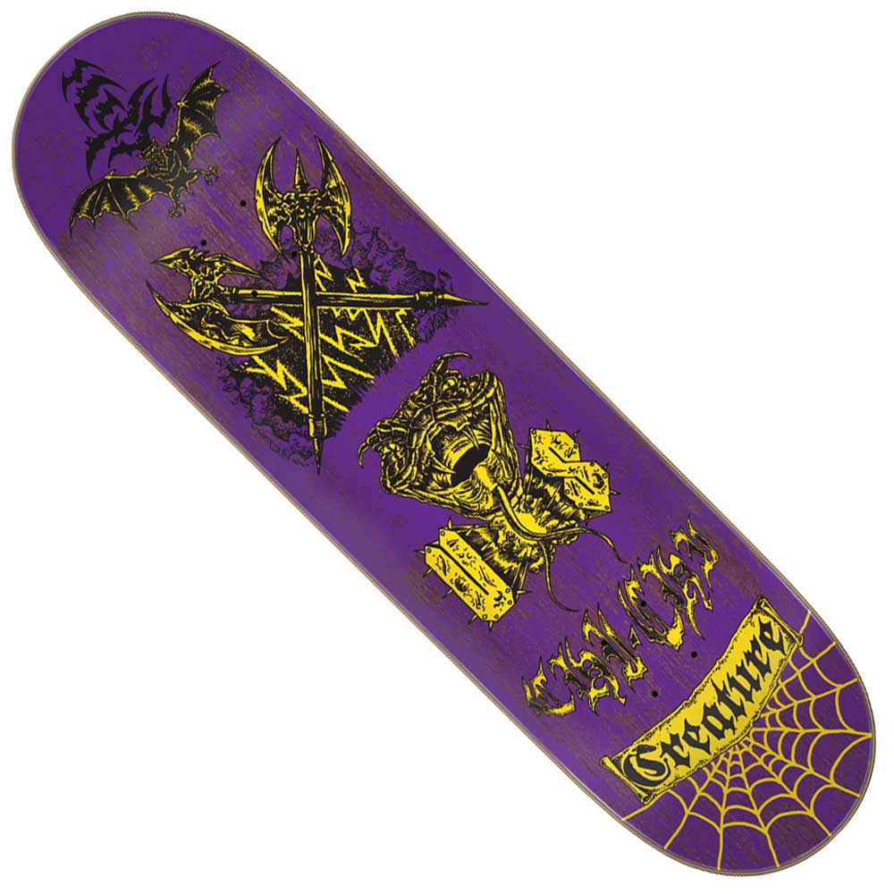 The Torres Creach Us Pro Stumps 8.51in x 31.88in Creature Skateboard Deck features purple wood, yellow and black bat, crossed axes, goblet, "SPLIT," spider web graphics, and "Creature" at the tail; part of the Torres Creach collection.