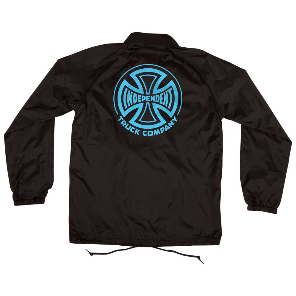 The Truck Co Legacy Coach Windbreaker Longsleeve Jacket in black and blue features a large Independent cross logo on the back, elastic cuffs, and a drawstring hem for stylish comfort on or off your board.