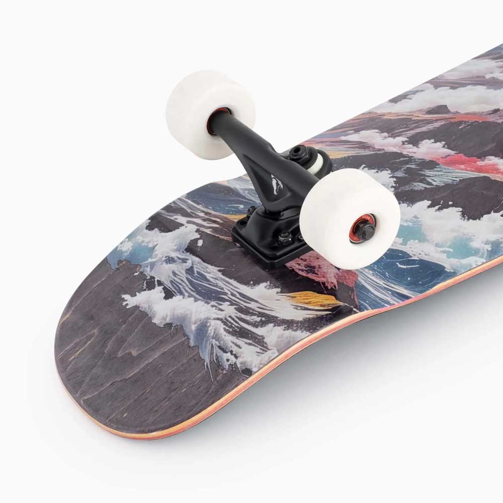 Close-up of the Tugboat Atmosphere Landyachtz Complete Skateboard, showcasing vibrant ocean waves and birds artwork on the deck, black trucks, white wheels—ideal for urban cruising—set against a plain white background.