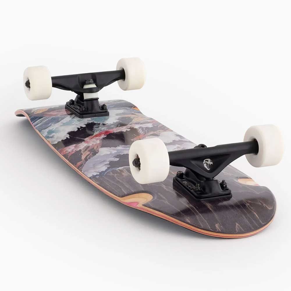 The Tugboat Atmosphere Landyachtz Complete Skateboard features a compact deck with an artistic landscape design, white wheels, and black trucks—perfect for urban carving and smooth city cruising. Shown on a white background.