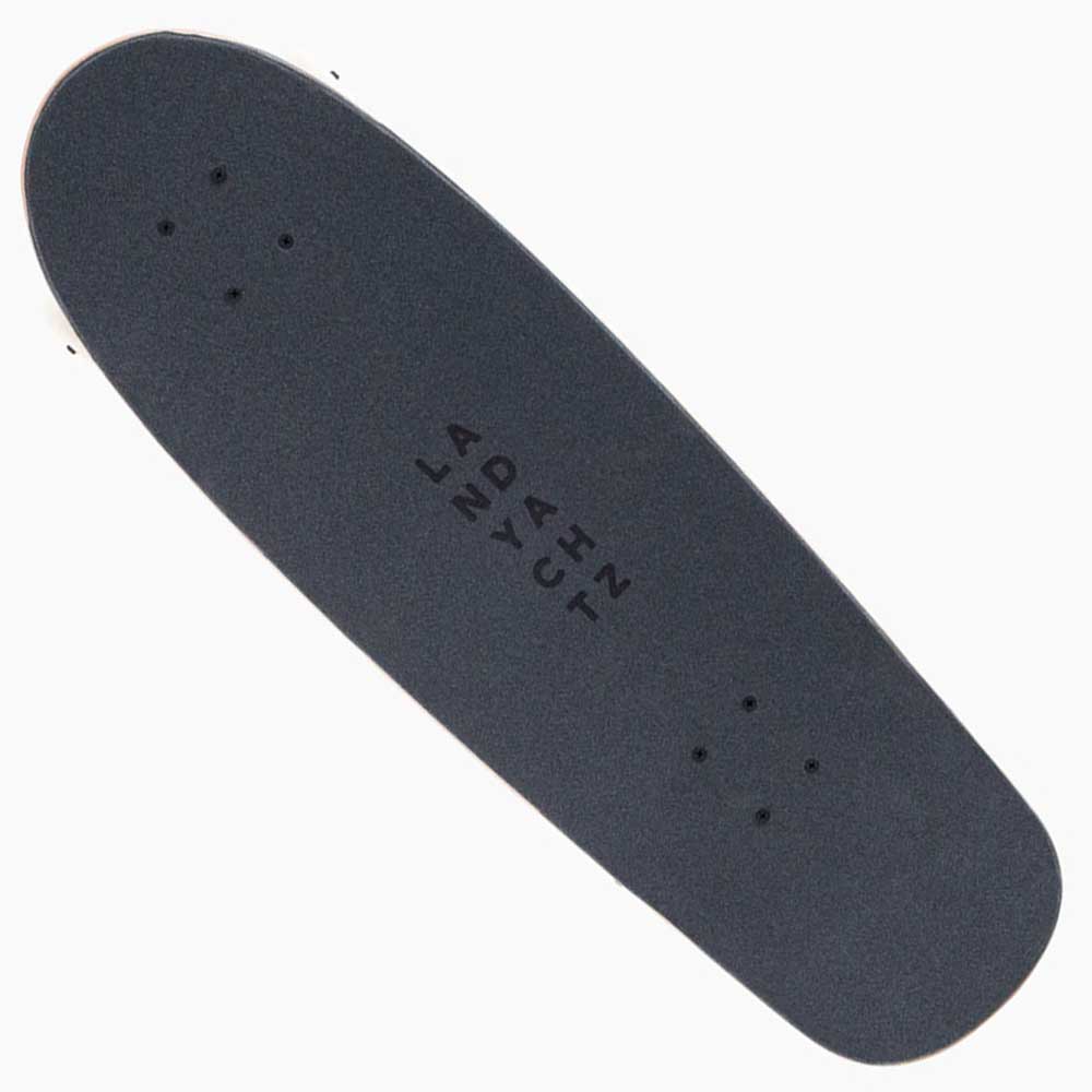 The Tugboat Atmosphere Landyachtz Complete Skateboard features a black compact deck with four sets of mounting holes and LANDYACHTZ branding—ideal for urban carving.