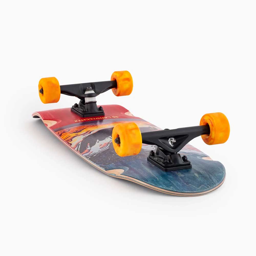 The Tugboat Nightfall Landyachtz Complete Skateboard, made from durable Canadian maple, features a colorful abstract deck, black trucks, and bright orange wheels, displayed on a white background.