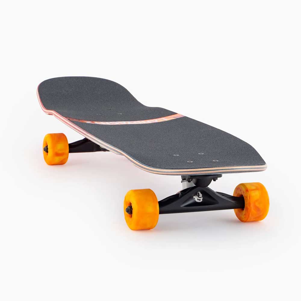 The Tugboat Nightfall Landyachtz Complete Skateboard is a modern cruiser made from Canadian maple, with black grip tape, orange Hawgs wheels, and a slightly concave deck, photographed on a white background.