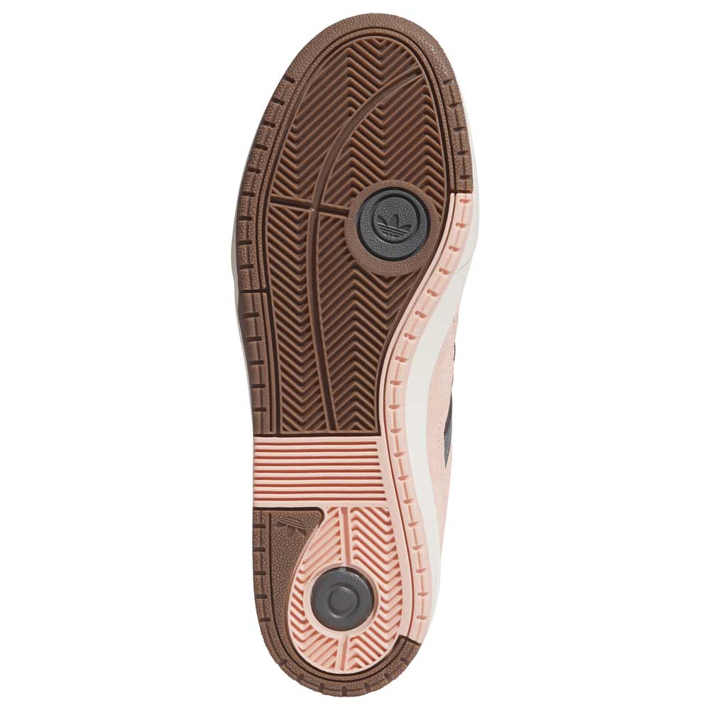 The image shows the sole of the Tyshawn 2 II Pink Green HQ4733 Adidas Skateboarding Shoes, featuring a brown textured pattern with circular grip details, cream-colored outer edges, and the Adidas logo for enhanced traction.