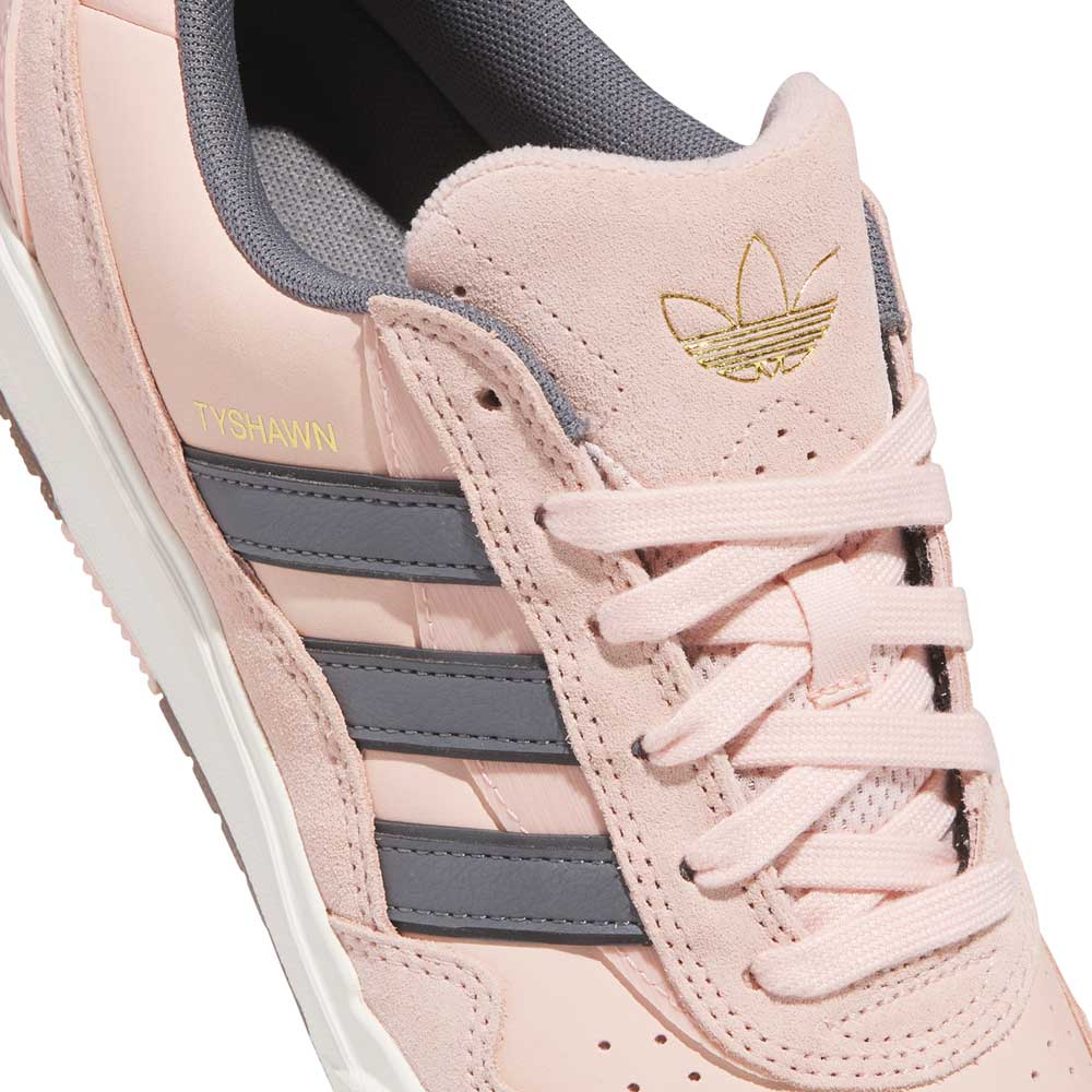 Close-up of the Tyshawn 2 II Pink Green HQ4733 Adidas Skateboarding shoe featuring light pink upper, grey stripes, white sole, gold TYSHAWN and Trefoil logo on side and tongue, light pink laces, and grey interior lining.